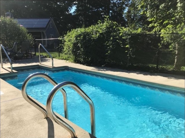 view of pool with a fenced in pool and a patio area