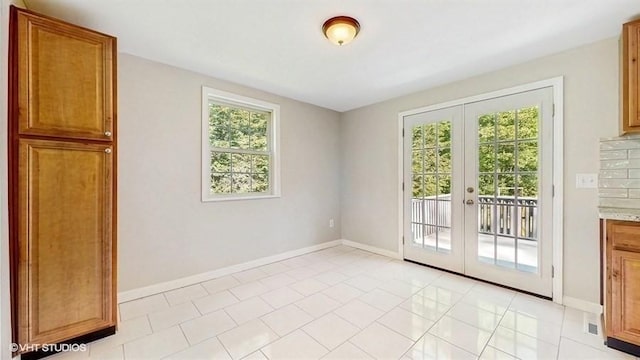 4 Gary Rd, Norton, MA 02766 - unfurnished room with french doors, light tile patterned floors, and baseboards