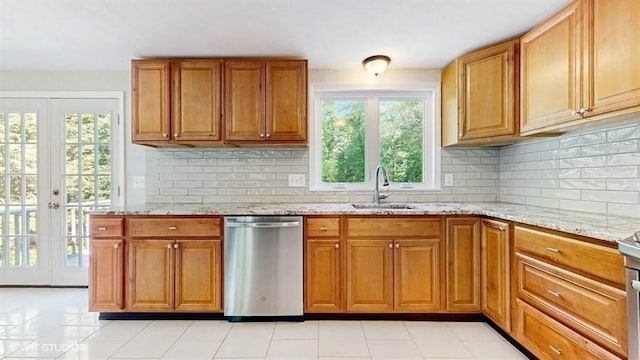 4 Gary Rd, Norton, MA 02766 - kitchen with stainless steel dishwasher, a sink, brown cabinetry, and healthy amount of natural light