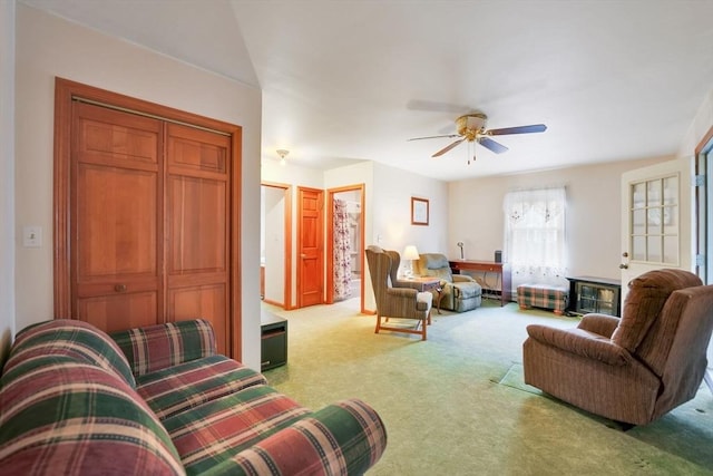 living room with ceiling fan and light carpet