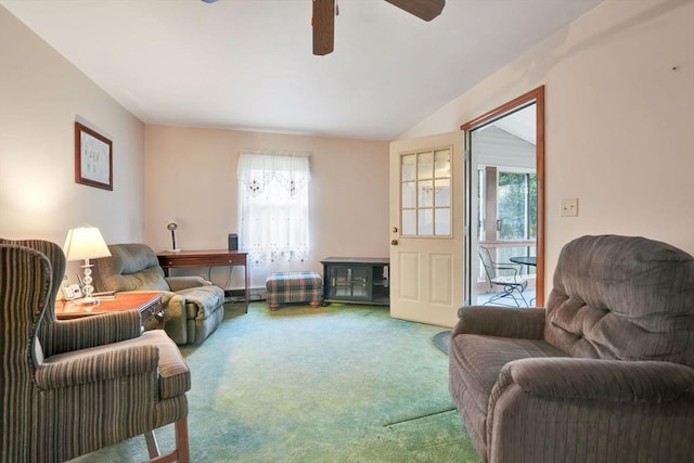 living room featuring ceiling fan, plenty of natural light, carpet, and vaulted ceiling