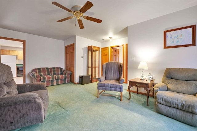 living room featuring ceiling fan and carpet floors