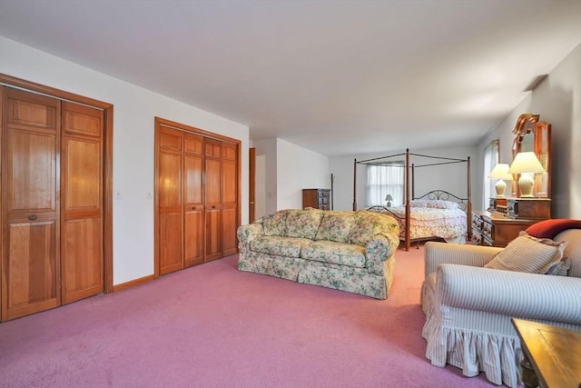 carpeted bedroom with multiple closets