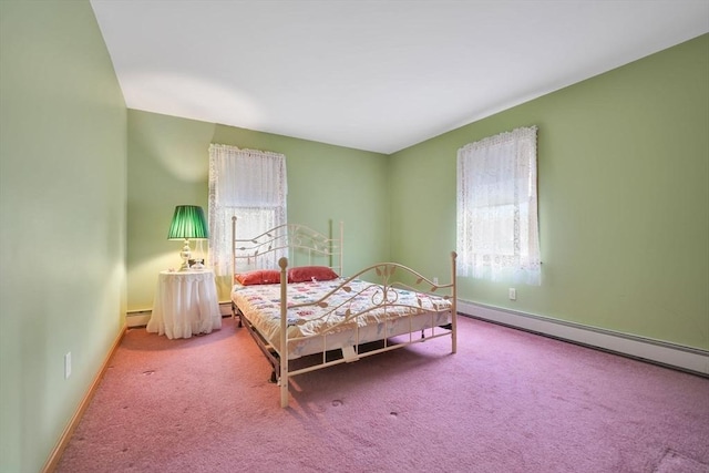 carpeted bedroom with a baseboard radiator