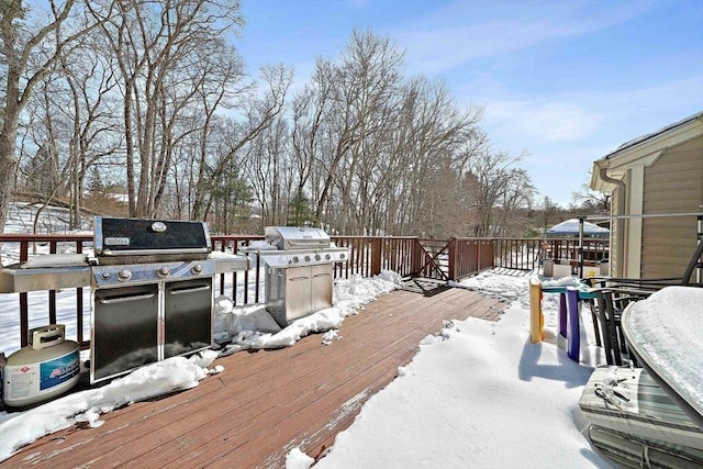 snow covered deck with area for grilling