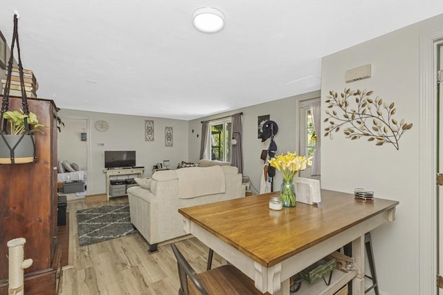 dining area with light wood-style floors