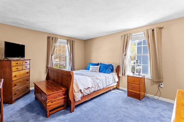 bedroom featuring carpet floors and baseboards
