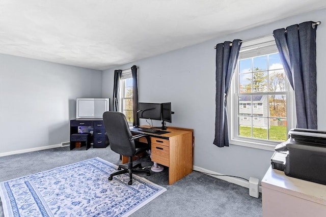 office space with a healthy amount of sunlight, carpet floors, and baseboards