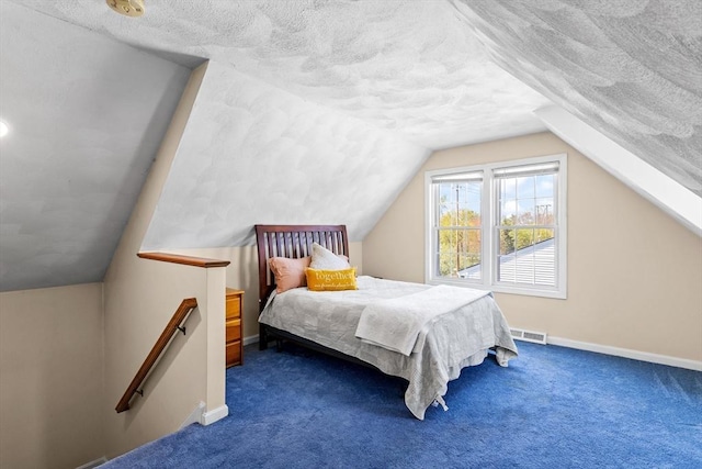 bedroom featuring visible vents, a textured ceiling, carpet, baseboards, and vaulted ceiling