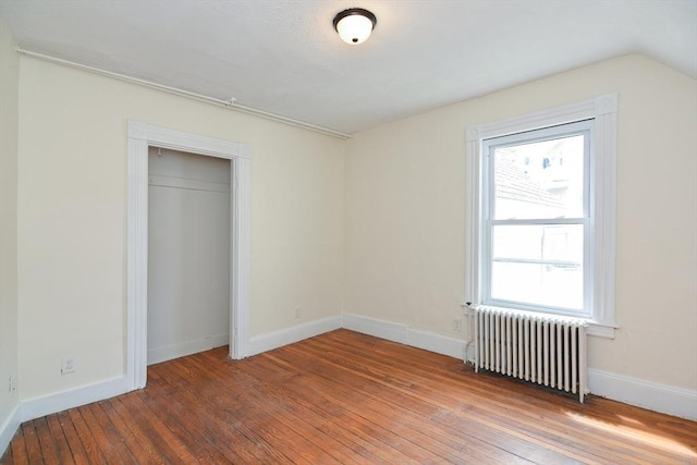 51 Garfield Ave, Revere, MA 02151 - unfurnished bedroom with radiator, wood-type flooring, and baseboards
