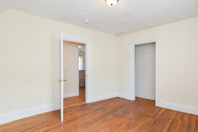 51 Garfield Ave, Revere, MA 02151 - unfurnished bedroom with wood finished floors, baseboards, and a closet