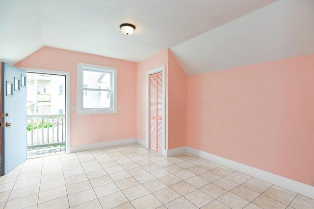 51 Garfield Ave, Revere, MA 02151 - bonus room featuring lofted ceiling, light tile patterned flooring, and baseboards