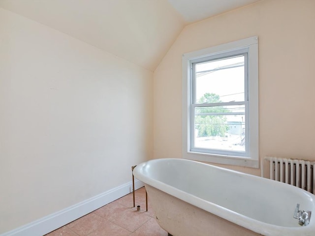 51 Garfield Ave, Revere, MA 02151 - full bath featuring radiator, a soaking tub, tile patterned flooring, lofted ceiling, and baseboards