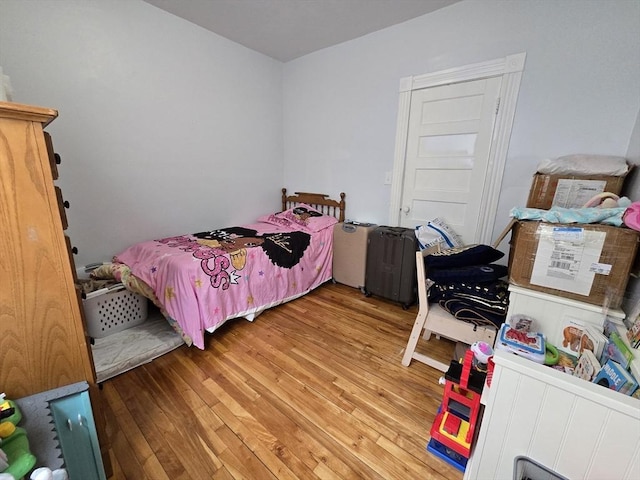 bedroom with light wood-style floors
