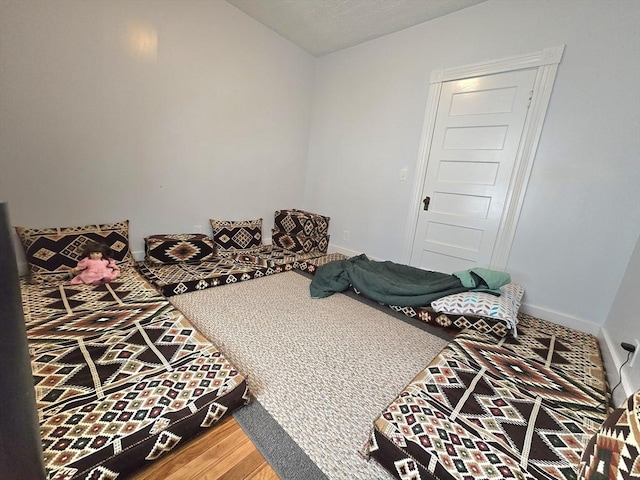 bedroom featuring wood finished floors