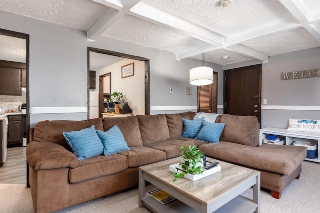 carpeted living room featuring coffered ceiling, a textured ceiling, and beam ceiling