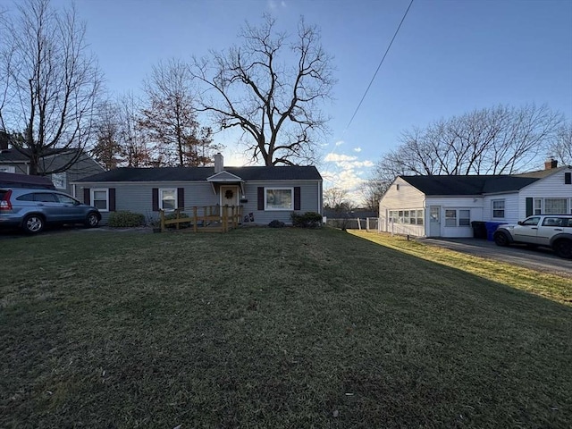 ranch-style home featuring a front yard