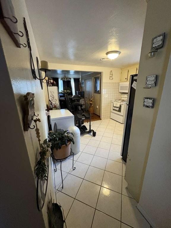 hallway featuring light tile patterned floors