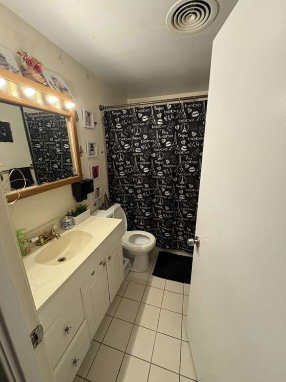 bathroom featuring tile patterned floors, vanity, toilet, and a shower with curtain