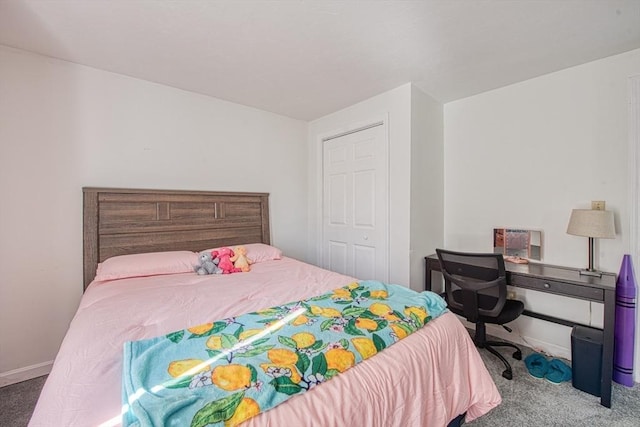 bedroom featuring a closet and carpet flooring