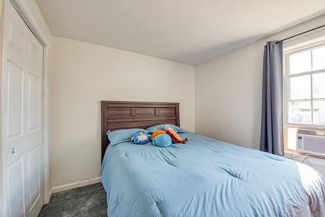 carpeted bedroom with baseboards