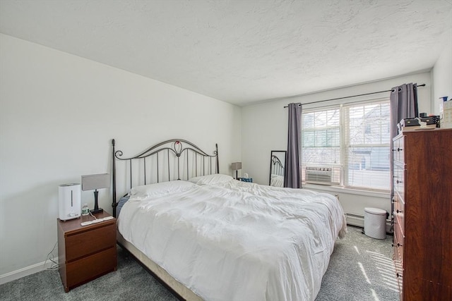 carpeted bedroom featuring cooling unit, a textured ceiling, a baseboard heating unit, and baseboards