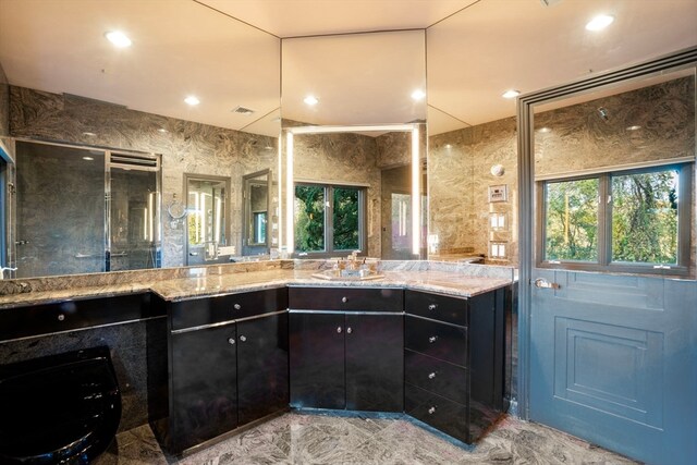 bathroom with vanity and an enclosed shower