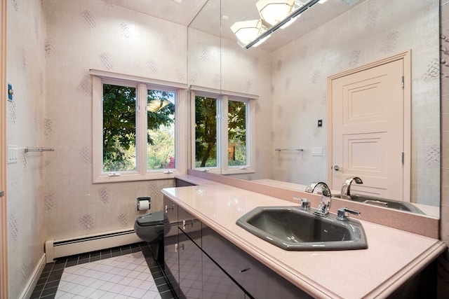 bathroom featuring vanity, toilet, tile patterned floors, and baseboard heating