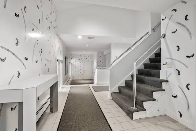 tiled foyer featuring a baseboard radiator