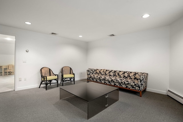 living area with carpet floors and a baseboard radiator