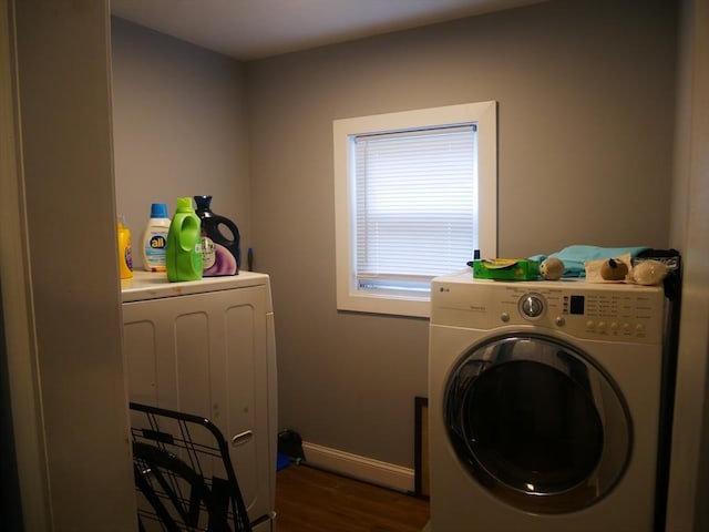 25 Dana St, Lowell, MA 01850 - laundry area featuring separate washer and dryer, dark wood-style flooring, and baseboards
