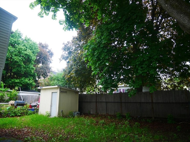 25 Dana St, Lowell, MA 01850 - view of yard featuring fence, a storage shed, and an outbuilding