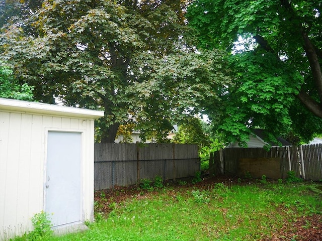 25 Dana St, Lowell, MA 01850 - view of yard featuring fence, a storage shed, and an outbuilding