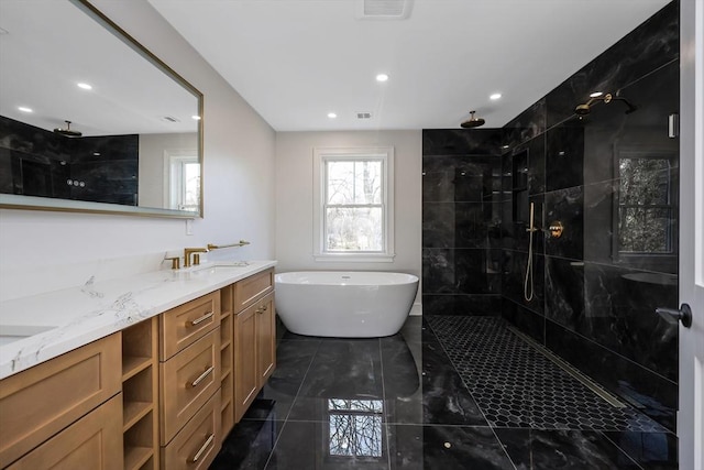 bathroom with vanity and independent shower and bath