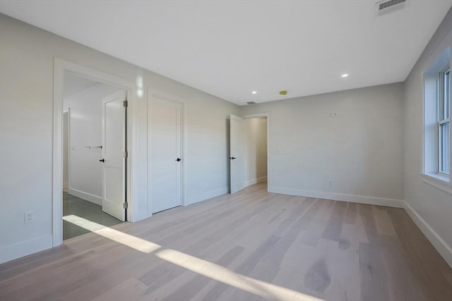 unfurnished bedroom featuring light hardwood / wood-style floors