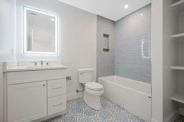 full bathroom featuring tile patterned flooring, vanity, toilet, and tiled shower / bath combo