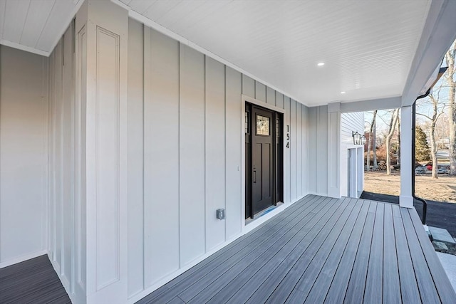 wooden terrace featuring covered porch