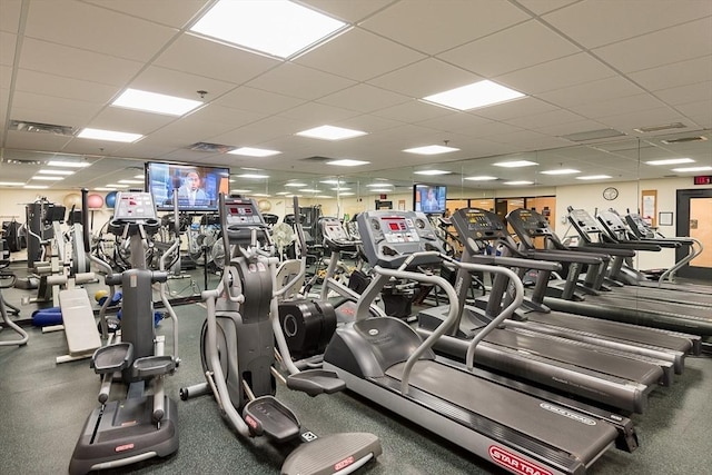 gym with a paneled ceiling