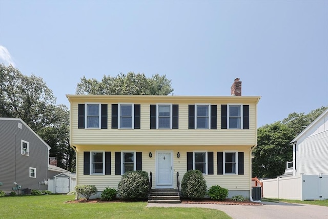 27 Perry H Henderson Dr, Framingham, MA 01701 - colonial-style house with a chimney and a shed