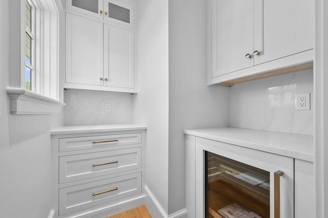287 Cedar St, Chatham, MA 02633 - detailed view of beverage cooler, baseboards, and backsplash