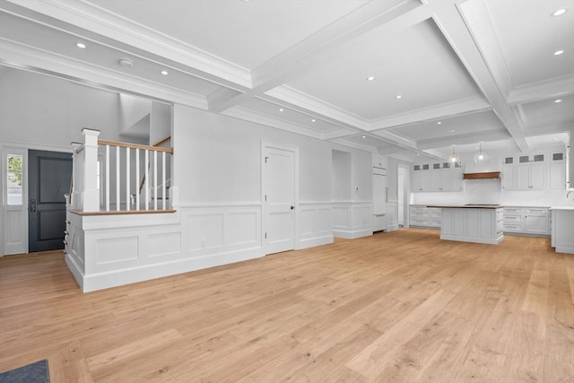 287 Cedar St, Chatham, MA 02633 - unfurnished living room featuring beam ceiling, light wood-style floors, a decorative wall, coffered ceiling, and stairway