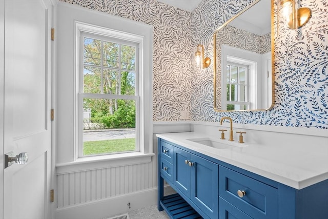 287 Cedar St, Chatham, MA 02633 - bathroom with wallpapered walls, a wainscoted wall, and vanity