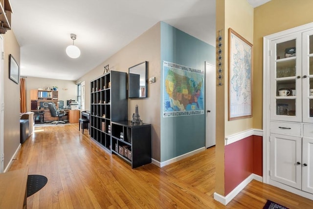 corridor featuring light hardwood / wood-style flooring