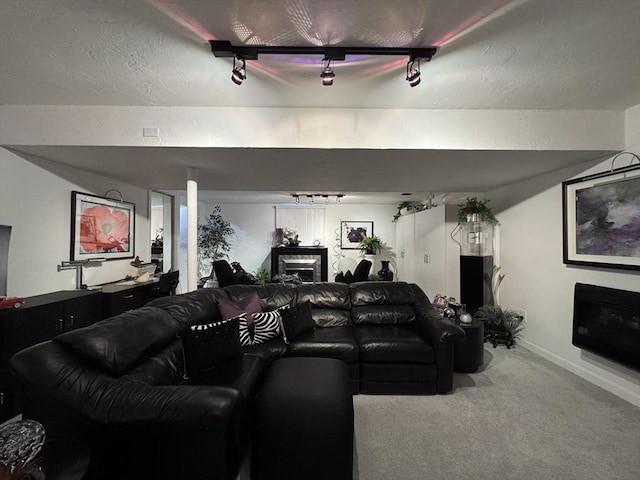 interior space featuring carpet floors and track lighting