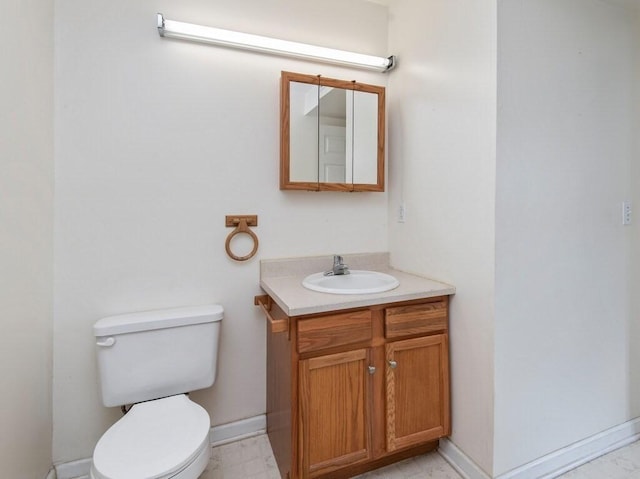 218 Reservoir St Unit 211, Holden, MA 01520 - bathroom featuring toilet, vanity, and baseboards