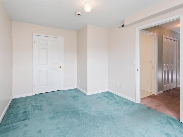 218 Reservoir St Unit 211, Holden, MA 01520 - empty room featuring carpet, baseboards, and a smoke detector