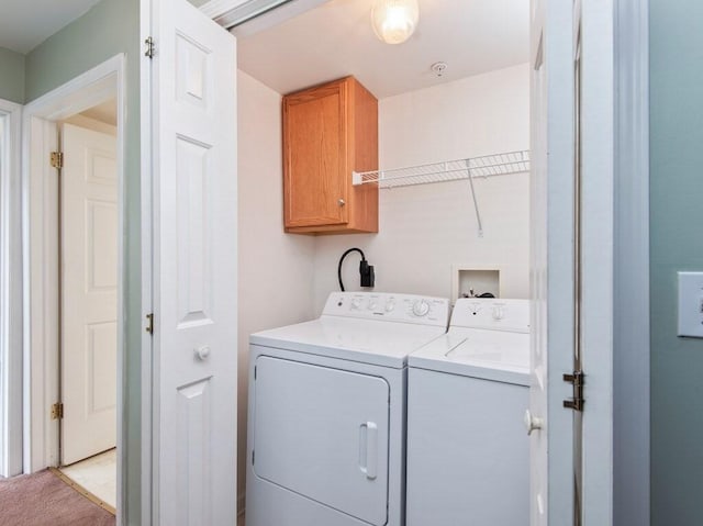 218 Reservoir St Unit 211, Holden, MA 01520 - laundry area featuring cabinet space, washing machine and clothes dryer, and light carpet