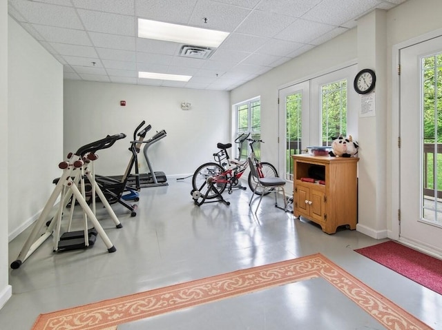 218 Reservoir St Unit 211, Holden, MA 01520 - workout room featuring healthy amount of natural light, a drop ceiling, and baseboards
