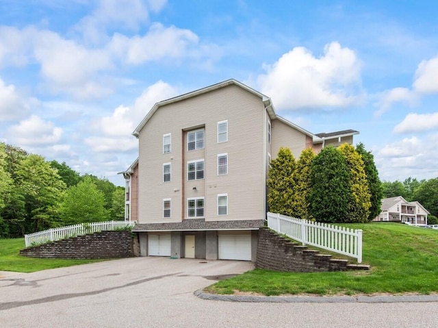 218 Reservoir St Unit 211, Holden, MA 01520 - view of property exterior with a garage and driveway