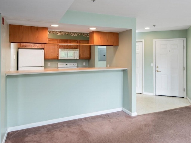 218 Reservoir St Unit 211, Holden, MA 01520 - kitchen featuring white appliances, electric panel, brown cabinets, recessed lighting, and carpet